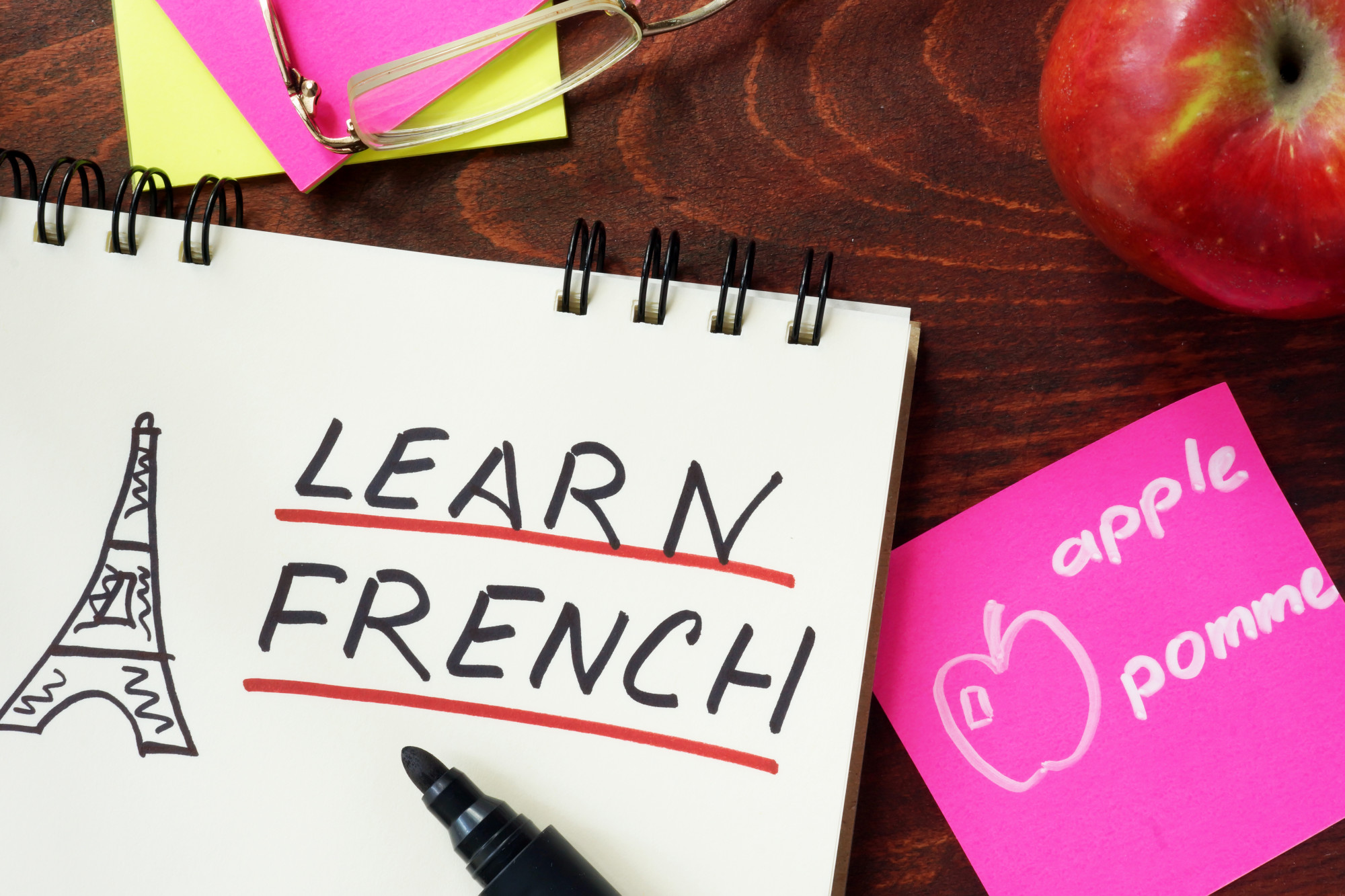 "Learn French" written in a notebook.