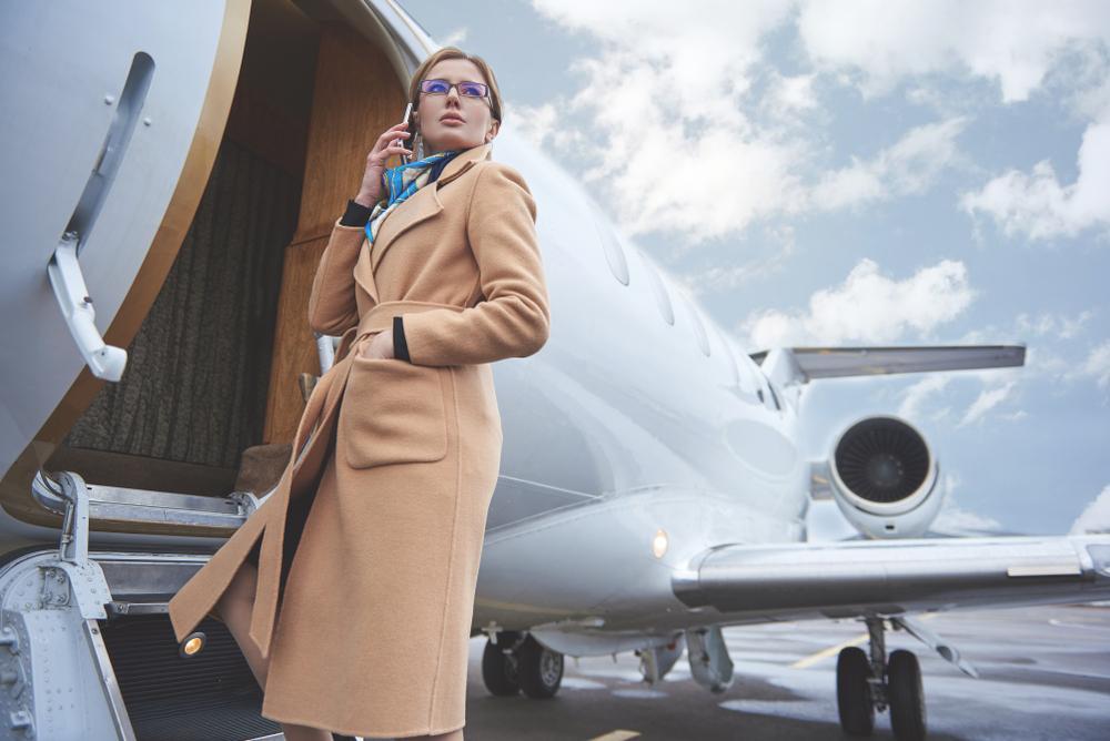 Woman boarding a private jet.