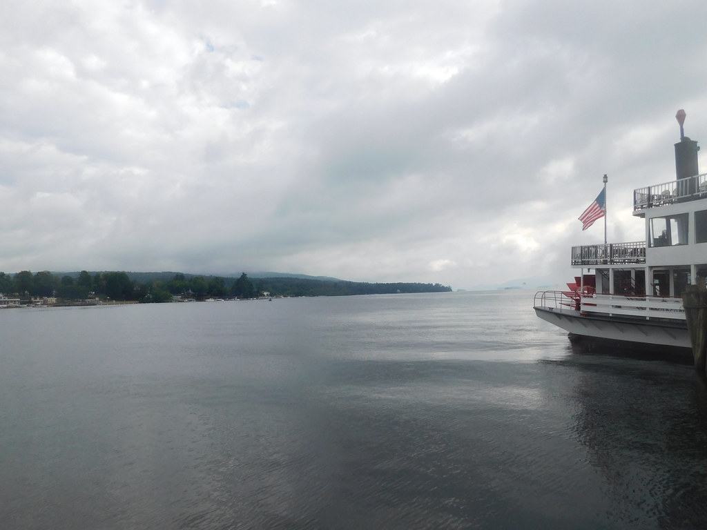 View of an overcast Lake George with a boat on it, New York.