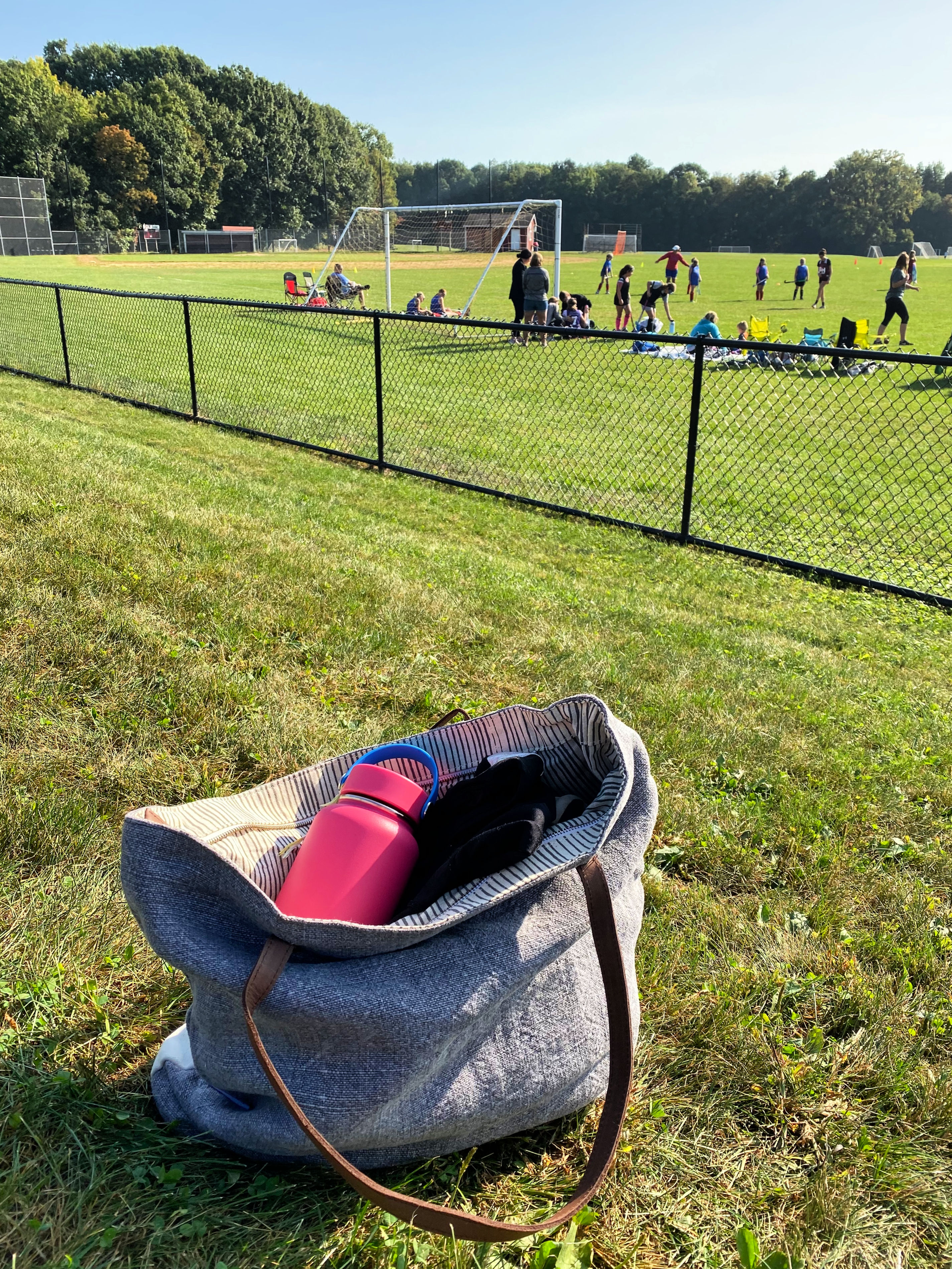 Hello Sunday tote at a soccer field.
