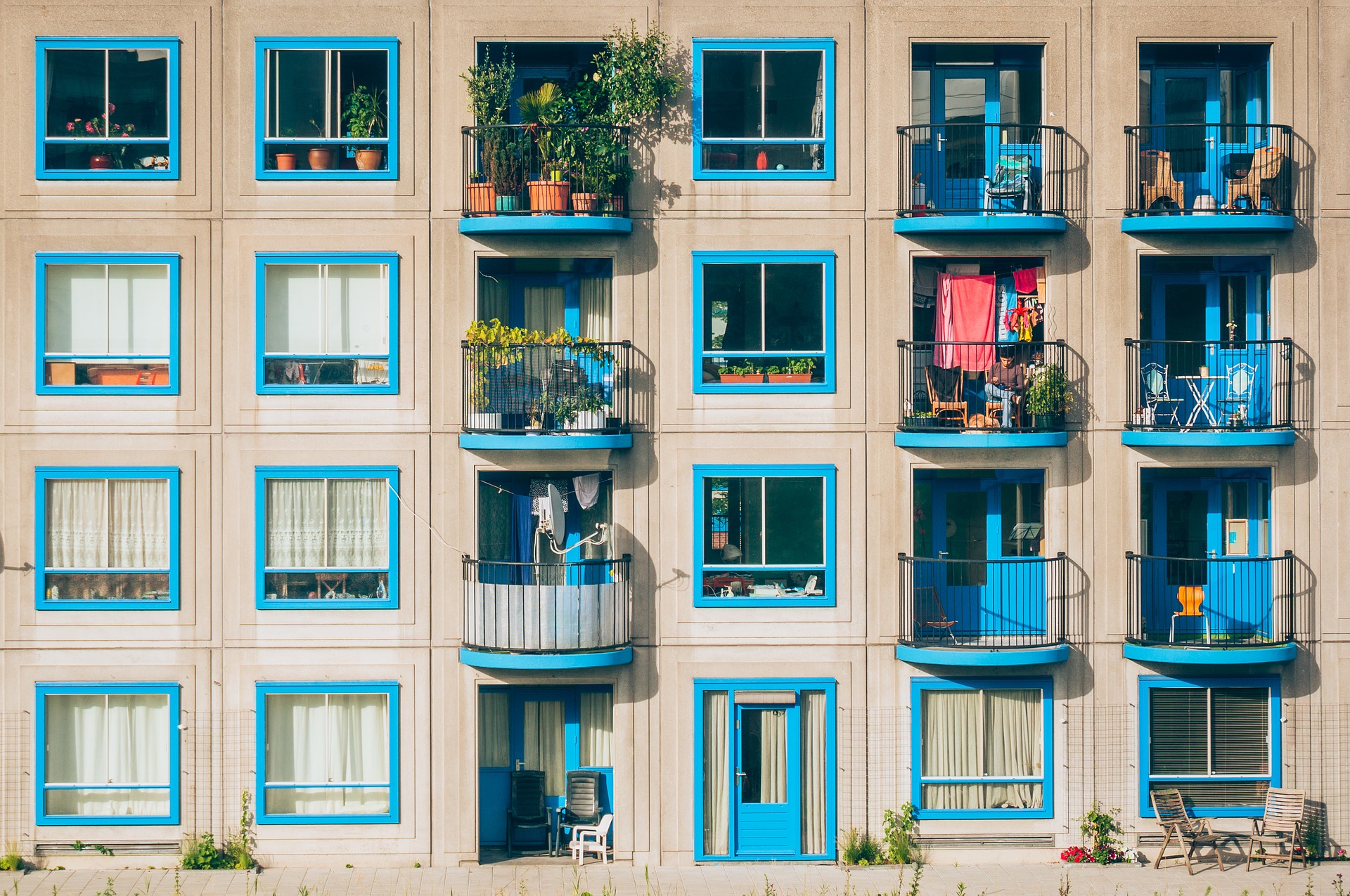 Apartment building with many windows and balconies.