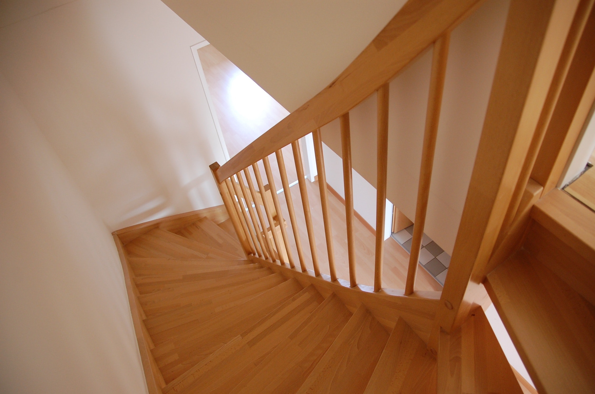 View of wooden staircase from the top.