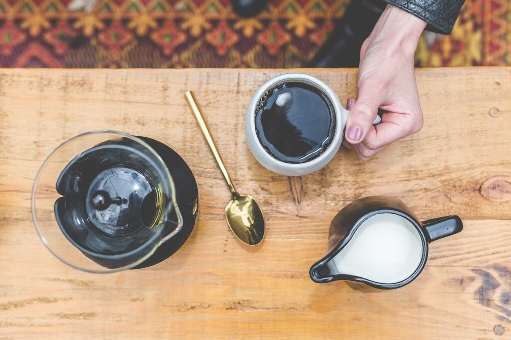 Overhead view of a table with coffee and creamer