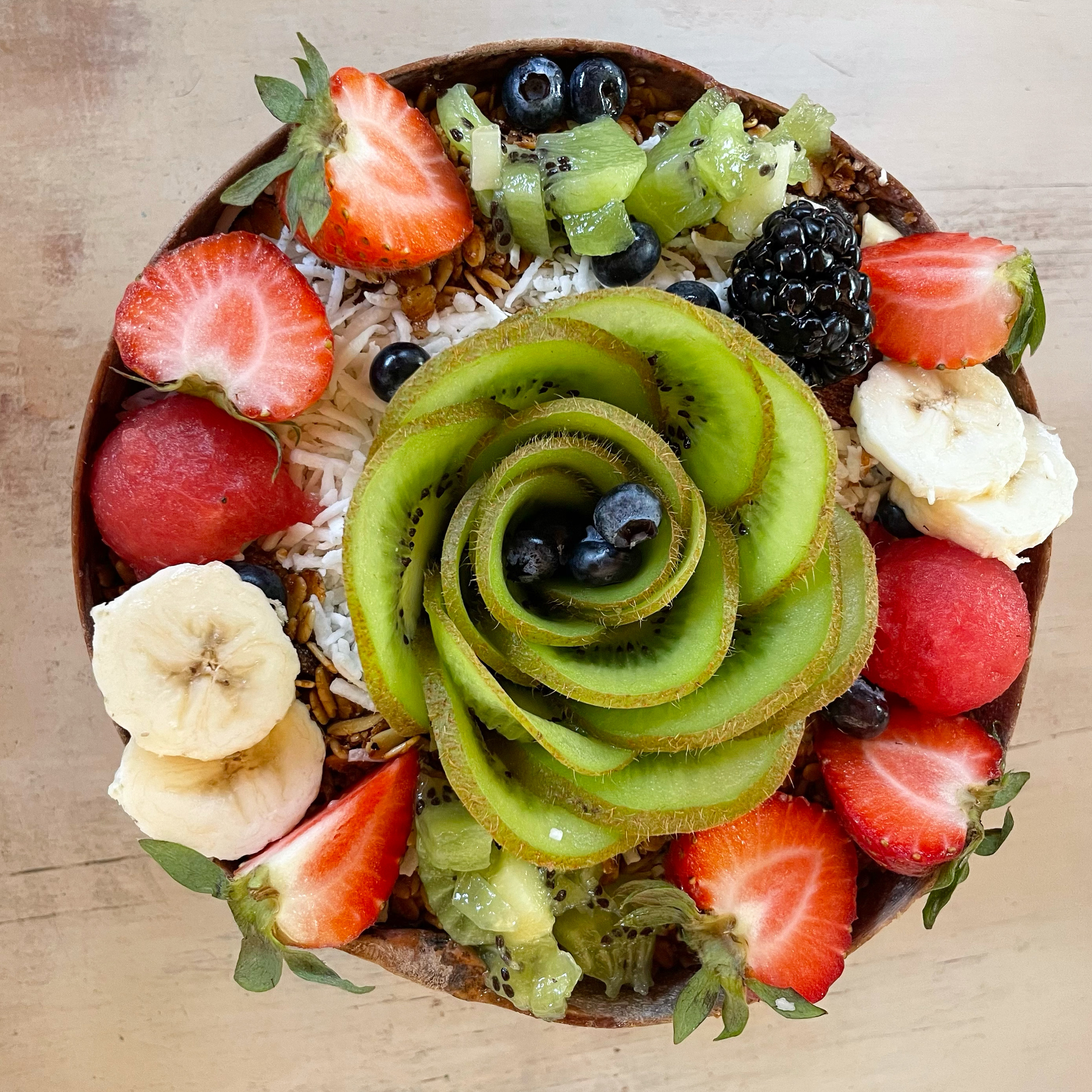Smoothie bowl with a variety of fruit on top